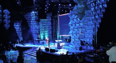 The stage located at the head of the arena floor featured suspended clusters of 3-D lit geometric-shaped structures, making the expansive space seem more intimate.