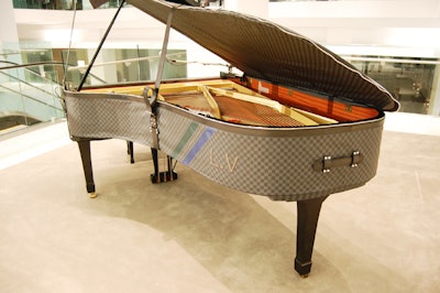 A piano cover with the Damier Graphite design was flown in from Paris for the dinner.