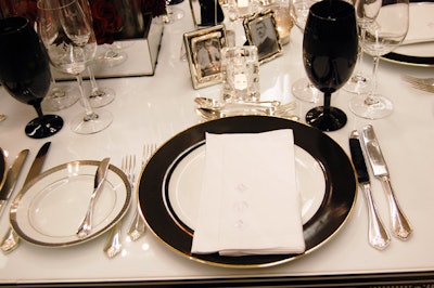 Place settings for the 100 guests included monogrammed napkins and wine glasses.