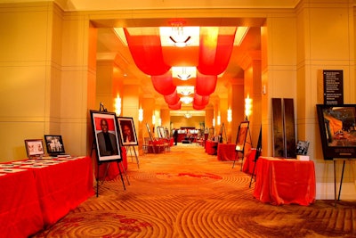 Hanging red sashes framed the pre-dinner reception space, which also featured silent auction items and portraits of celebrities who have dyslexia.