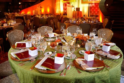 Each place setting provided guests with an award overview booklet and cubed menu card, both printed by AARP Creative.