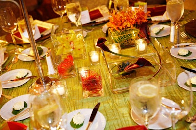 Textured linens and floral centerpieces crafted by Kehoe Designs draped all dining tables.
