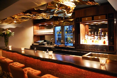 Zac Ridgely used gold anodized aluminum to create the ceiling fixture that hangs above the bar.