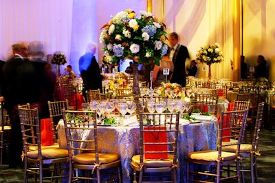 Jack H. Lucky Floral Design crafted four-foot-tall centerpieces of white roses and blue hydrangeas.