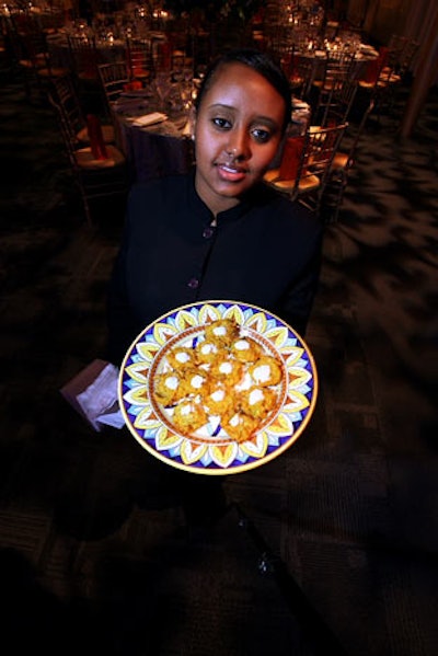 Servers passed hors d'oeuvres such as roasted butternut squash latkes with cinnamon creme fraiche during the cocktail reception.