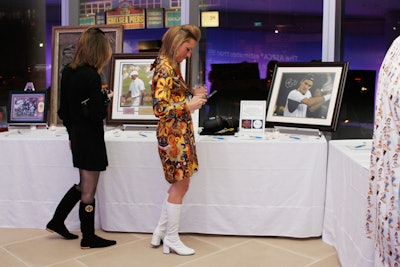 Auction tables held items like signed artwork from Leroy Neiman, sports memorabilia, and an exotic-car driving tour.