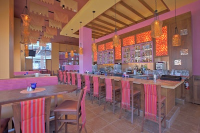 The restaurant's main dining area, which includes bar seating for 10, can accommodate 500 people for an event.