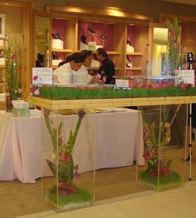 Joy Wallace's team set up a custom high-top filled with flowers and grass, in addition to its serving table.