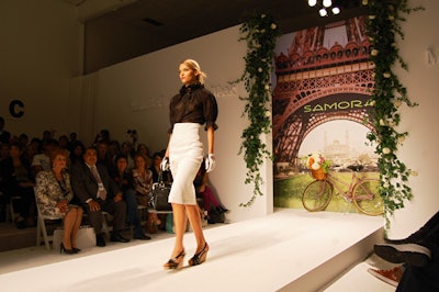 For Samora's presentation on Thursday evening in Stage One, ivy dotted with white flowers climbed the walls alongside the entrance to the runway and filled the basket of a bicycle meant to evoke a Paris street scene. (The obstacle caused minimal awkwardness as models passed.)