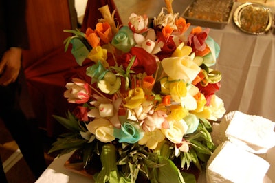 During the cocktail reception, a fake floral arrangement made from peeled and dyed vegetables decorated Senior Lifestyle Corporation's chef station.