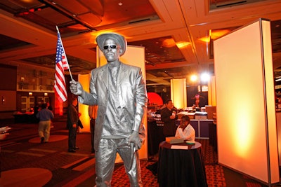 Street performer Preston Dinwitty, known locally as 'Silver Man,' provided entertainment during the event.