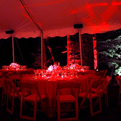 Custom-made red silk cloths and centerpieces of red waxy anthurium adorned the tables.