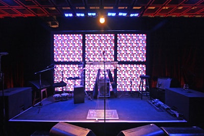 The room's focal point was the stage's glowing backdrop, made up of the same color swatches as the centerpieces. Sting performed a three-song set around 10:15 p.m.