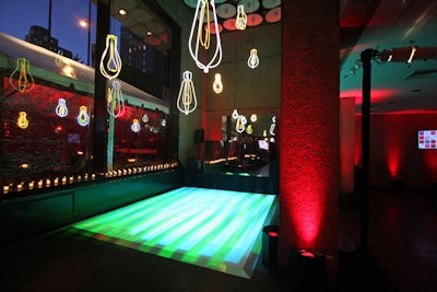 The use of light and mirrors continued in the studio party space, with an ever-changing neon dance floor, neon lightbulbs, and a mirrored DJ booth.