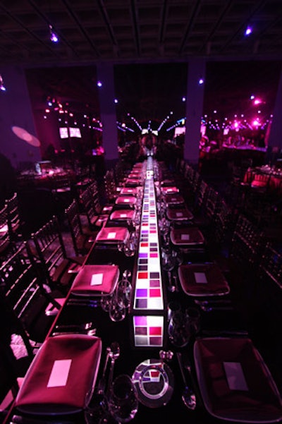 Satin linens in maroon and plum hues topped the long rectangular and round tables.