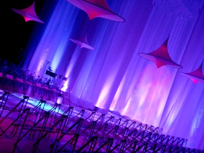 Ice blue lighting, suspended spandex lamps, an illuminated runway, and elegant black and white draping transformed the ballet studio.