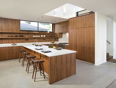 The space features built-in American walnut cabinetry.