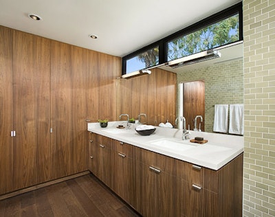Bathrooms feature ceramic tiles and walnut cabinets.