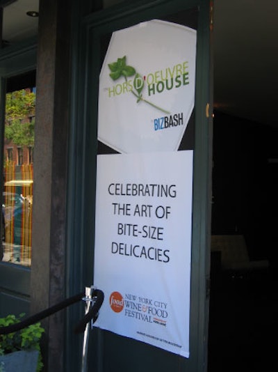 A banner hung outside the temporary Hors d'Oeuvre House. Event signage was provided by Better Mousetrap.