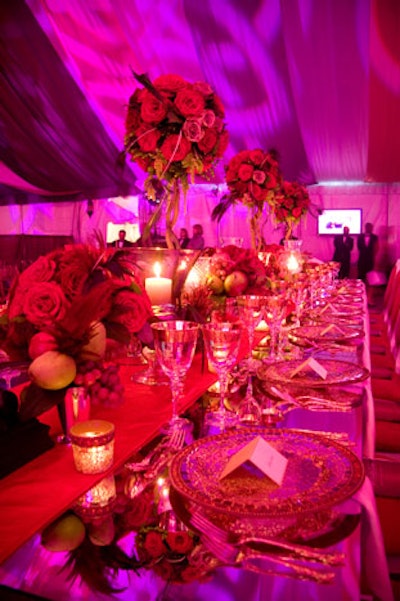 Floral arrangements of roses and peacock feathers decorated the dinner tables.