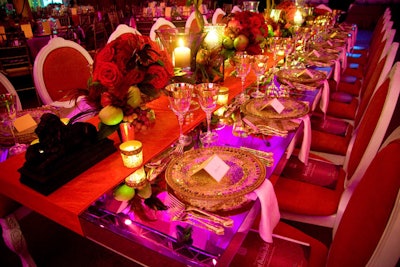 Individual place settings included mosaic-mirror and jeweled chargers, gold-patterned tipped stemware, and gold flatware.