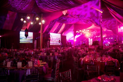 Instead of a traditional white-tented ceiling, the P.W. Feats planners used a custom burgundy liner to up the drama in the dinner tent.