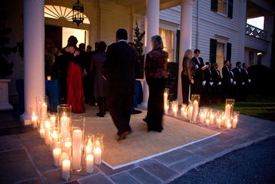 Candles and a line of staffers greeted guests as they entered the event through the Shriver residence.