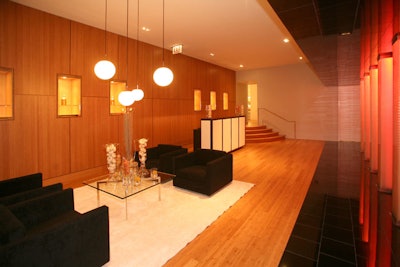 Sleek lounge furniture and glowing glass columns accent the spa's reception area, which is available for private events.