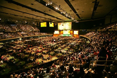 About 3,500 guests sat for boxed lunches on the arena floor during the luncheon session, and thousands of others packed the seats above.