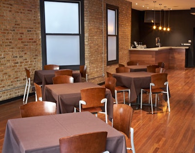 A chalkboard that guests are free to write on covers the back wall of the private dining room.