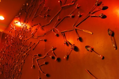 The focal point of the lounge is an interactive piece with magnetized flatware. Visitors to the space are invited to create their own art with the metal items.