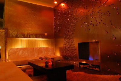 A small lounge in one section of the main floor features a working fireplace. Relevent worked with the city's fire department for permits and other necessary safety precautions.