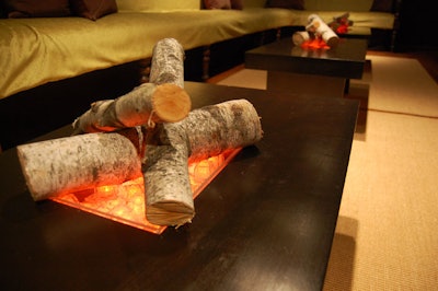 Fake fire pits inside low coffee tables decorate the seating areas in the mezzanine.