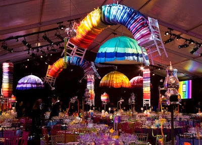 Umbrellas made from brightly colored tablecloths and twisted stacks of seat cushions hung from the ceiling.