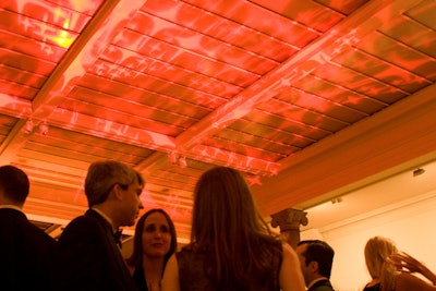 Red lighting played off of double-height ceilings and white columns.