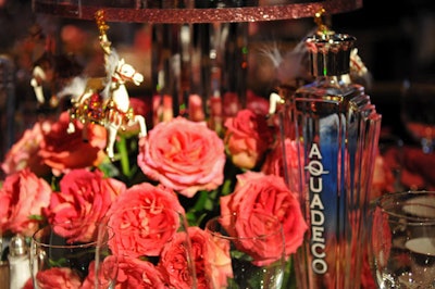 Roses and miniature carousels topped tables.