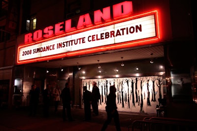 The design extended to the venue's exterior with the name of the event on the marquee and decals of birch trees covering the glass entrance.