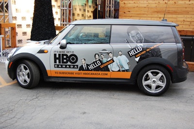 Minis covered in advertising for HBO Canada sat outside the venue.