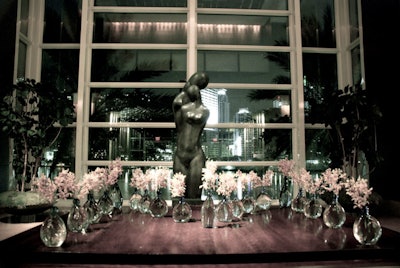 Crystal vases filled with pink cherry blossoms accented the elegant lobby.