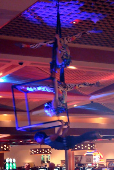 Aerialists performed to the sides of the stage at the beginning of the performance.