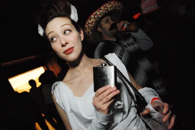 A crowd of costumed guests, aged 21 and over, sipped drinks from bars or personal stashes.