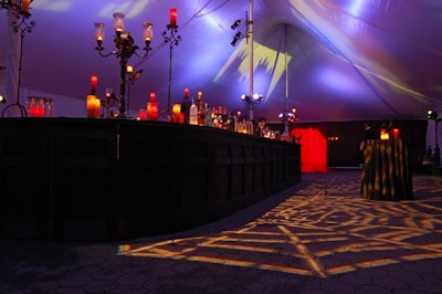 Silhouettes of turrets loomed over the gothic bar and candelabras.