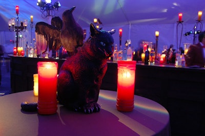 Riding the theme of bad luck, figurines of ominous animals like black cats and ravens sat on tables in the cocktail tent.
