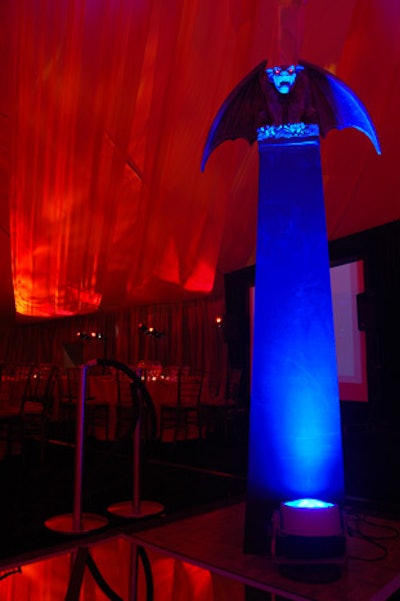 Four blue-lit gargoyles at each corner of the dance floor marked the dining room's only departure from red and orange decor.