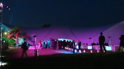 The outside of the tent was lit with projections of colorful flowers and resort images.