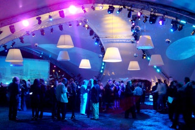 Everlast Productions drenched the tent in colorful blue and pink lighting and projections of the property's rendering.