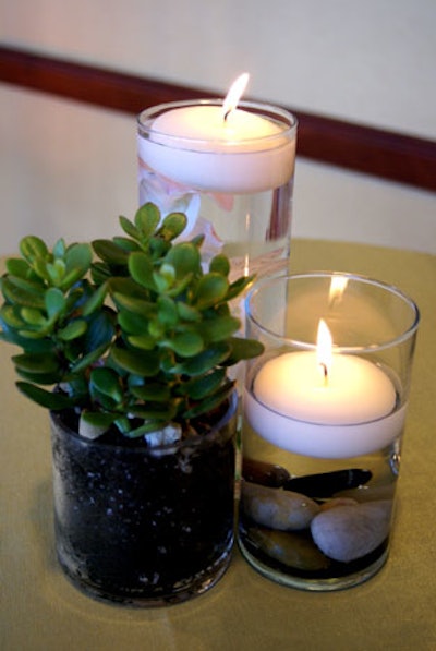 Glass cylinders were filled with botanicals, greenery, and even potting soil to represent the presence of the earth, while candles played into the element of fire.