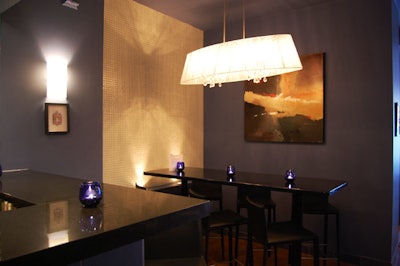 A table positioned in a small nook near the bar offers space for up to eight people.