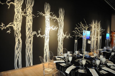Graffiti artist Mike Echlin painted trees against a black backdrop for a haunted-forest effect.