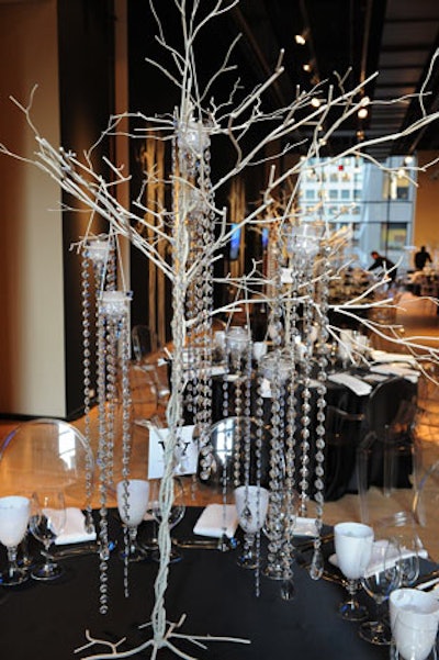 Centerpieces included branches hung with crystals and candles.